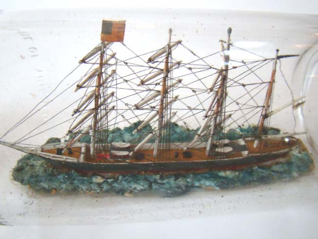 A highly detailed four masted ship in a bottle circa 1930 — image 2